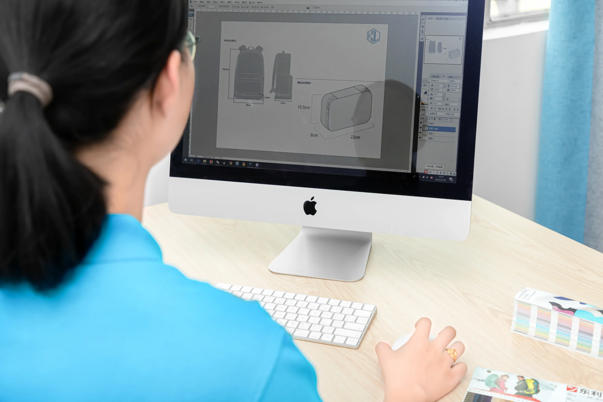 Female designer creating a 3D backpack model on a computer screen. Professional OEM Manufacturer design process for custom backpacks.