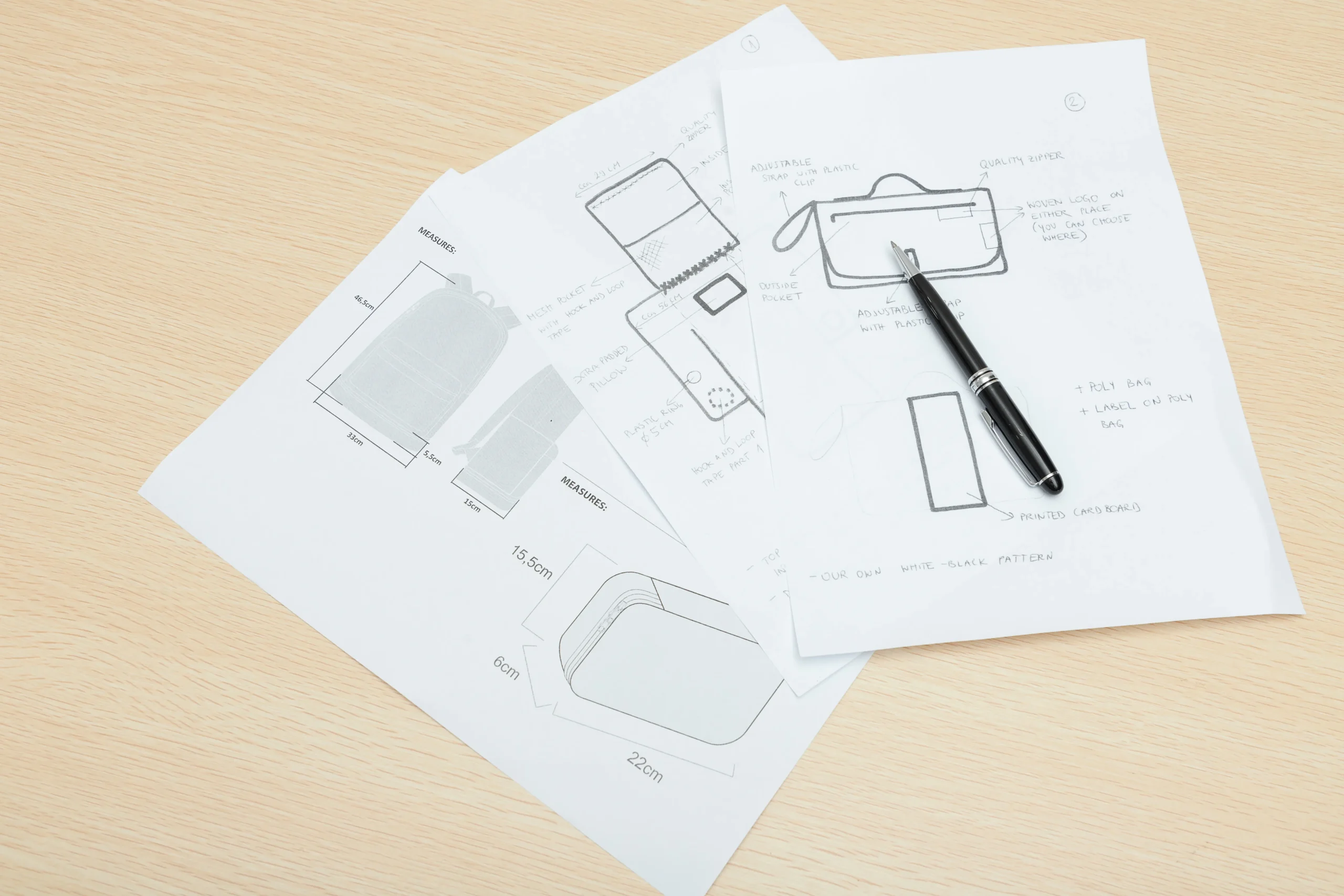 Hand-drawn backpack design sketches on paper with a pen. Conceptual design by a Custom Backpack Manufacturer.