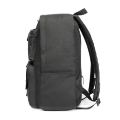Side view of a solid black tactical backpack showing its generous depth and robust main zipper. Spacious daily commuter bag by a Backpack Manufacturer.