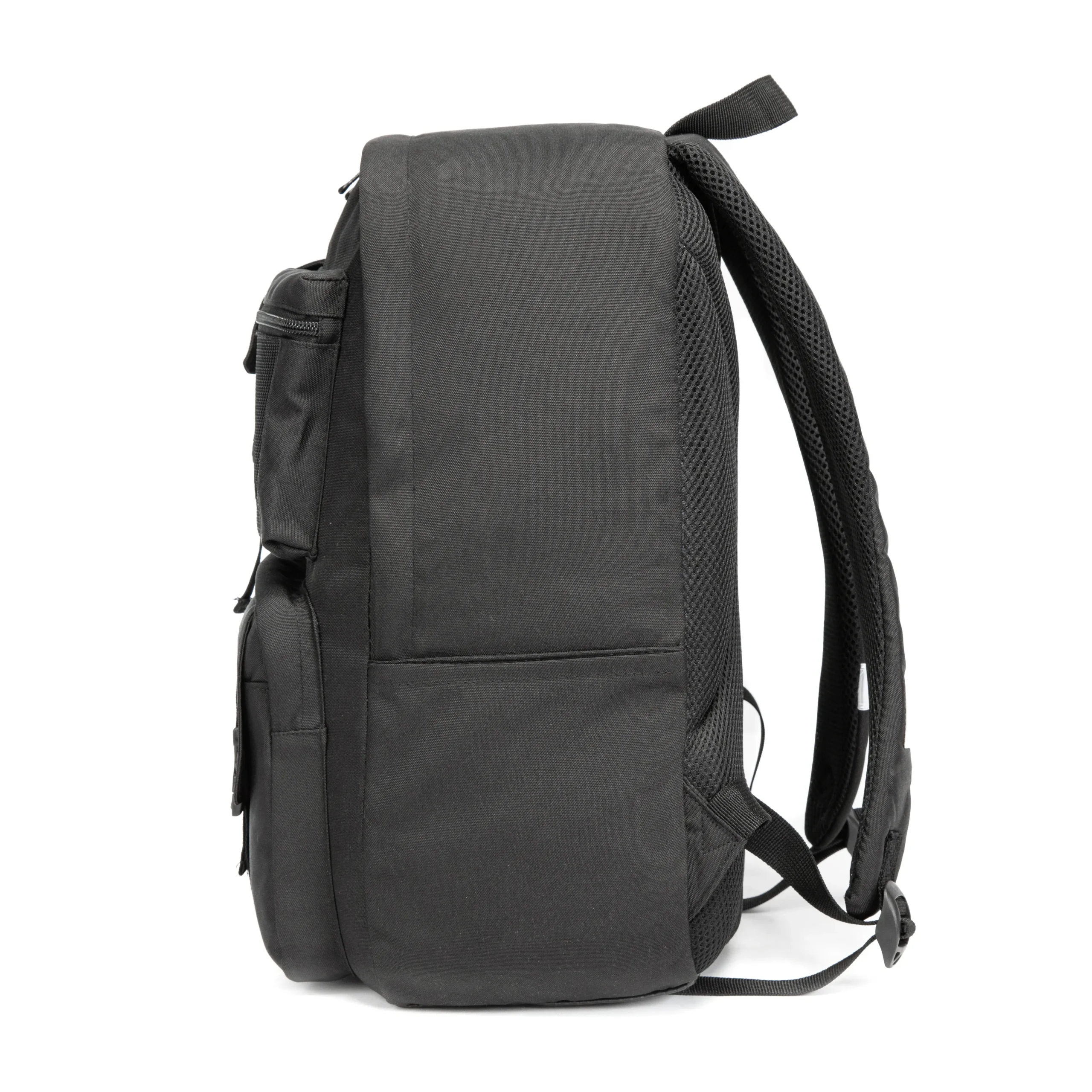 Side view of a solid black tactical backpack showing its generous depth and robust main zipper. Spacious daily commuter bag by a Backpack Manufacturer.