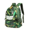 Slanted front view of a cool kids' backpack featuring a 3D monster face with big teeth, a yellow fin, and a green monster keychain. Fun school bag by a Backpack Manufacturer.