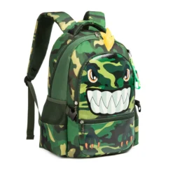 Slanted front view of a cool kids' backpack showing the 3D monster face, side pockets, and keychain charm. Practical school bag by a Custom Backpack Manufacturer.