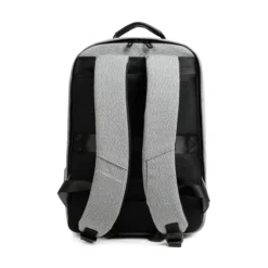 Full back view of a light grey minimalist backpack with thick air-mesh padding, padded straps, and an embossed leather logo patch. High-end commuter bag by a Backpack Supplier.