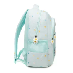 Side profile of a mint green daisy backpack showing its structural depth, star pattern, and flower-shaped zipper pulls. High-density fabric bag by a Custom Backpack Manufacturer.