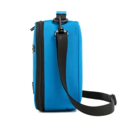 Side profile of a vibrant blue lunch bag showing its depth and adjustable black shoulder strap. High-density fabric bag by a Backpack OEM Supplier.
