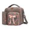 Slanted view of a dark gray glitter heart lunch bag with a matching detachable water bottle holder, heart-shaped zipper pulls, and a 3D bow patch. Functional luxury cooler by a Backpack Supplier.