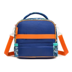Back view of a navy blue dinosaur-themed double-decker lunch bag with a solid navy back, an orange webbing strap, and an adjustable orange shoulder strap. Custom insulated lunch bag by a professional Backpack Manufacturer.