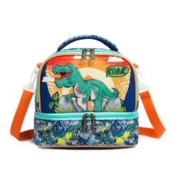 Front view of a blue dinosaur double-layer lunch bag featuring a T-Rex sunset graphic on the top and a graffiti pattern on the bottom. Versatile insulated lunch box by a Custom Backpack Manufacturer.