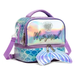Slanted view of a pastel purple mermaid lunch bag featuring a holographic front panel, a clear seashell charm, and a large mermaid tail zipper pull. Functional luxury cooler by a Backpack Supplier.