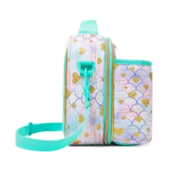 Side view of a mermaid-scale lunch bag showing the depth of the attached bottle holder and adjustable strap attachment. Functional luxury cooler by a Backpack Manufacturer.