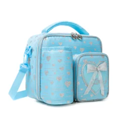 3D angled view of a sky blue glitter heart lunch bag highlighting the attached bottle sleeve, silver zippers, and the side strap attachment. Versatile daily cooler by a leading Backpack Supplier.