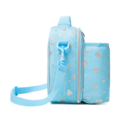 Side profile of a pastel sky blue glitter heart lunch bag showing its depth, adjustable shoulder strap, and continuous silver print. High-density fabric bag by a Backpack OEM Supplier.