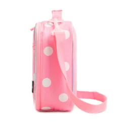 Side profile of a pastel pink polka dot lunch bag showing its depth, adjustable pink shoulder strap, and iridescent border. High-density fabric bag by a Backpack OEM Supplier.