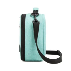 Side profile of a mint heather lunch bag showing its depth and adjustable black shoulder strap. High-density fabric bag by a Backpack OEM Supplier.