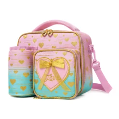 Slanted view of a pastel gradient lunch bag with a matching pink detachable bottle holder, heart-shaped zipper pulls, and a 3D bow patch. Functional luxury cooler by a Backpack Supplier.