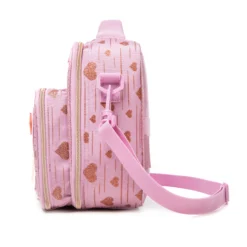 Side view of a pink glitter heart lunch bag showing the depth of the attached bottle holder and adjustable strap attachment. Functional luxury cooler by a Backpack Manufacturer.