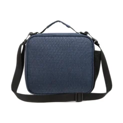 Back view of a denim blue geometric ripstop textured lunch bag with a black adjustable shoulder strap. Custom insulated lunch bag by a professional Backpack Manufacturer.