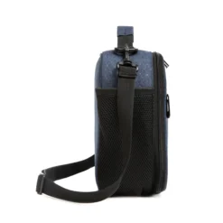 Side view of a denim blue ripstop lunch bag showing a large black mesh water bottle pocket and a sturdy strap swivel clip. Functional daily cooler by a Backpack Manufacturer.