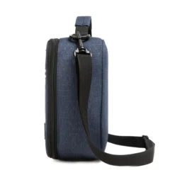 Side profile of a denim blue ripstop lunch bag showing its depth and adjustable black shoulder strap. High-density fabric bag by a Backpack OEM Supplier.
