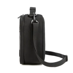 Side profile of an all-black lunch bag showing its depth and adjustable black shoulder strap. High-density fabric bag by a Backpack OEM Supplier.