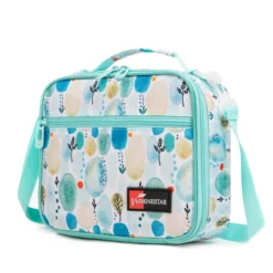 Slanted view of a mint green abstract print lunch bag with a front zipper pocket and red logo patch. Trendy school cooler by a Backpack Supplier.