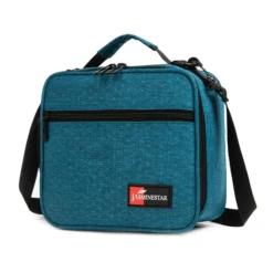 Slanted view of a teal blue ripstop textured lunch bag with a front zipper pocket and a red logo patch. Functional commuter cooler by a Backpack Supplier.