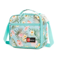 Slanted view of a mint green tropical floral lunch bag with a front zipper pocket and red logo patch. Trendy school cooler by a Backpack Supplier.