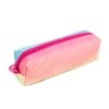 Side angle of a gradient pencil case highlighting the zipper placement. Fine accessory production by a Backpack Manufacturer.