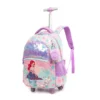 Slanted view of a cute mermaid rolling backpack featuring a shiny sequin front pocket, a 3D mermaid patch, and a purple pom-pom charm. Dreamy school trolley by a Backpack Manufacturer.