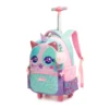 Slanted front view of a cute kids' rolling backpack featuring 3D sparkly ears, a soft fur pom-pom charm, and an extended telescopic handle. Adorable school trolley by a Backpack Manufacturer.